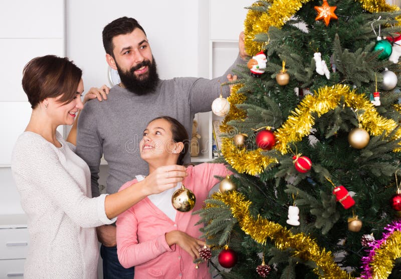 Family decorating tree stock image. Image of green, christmas - 88805961