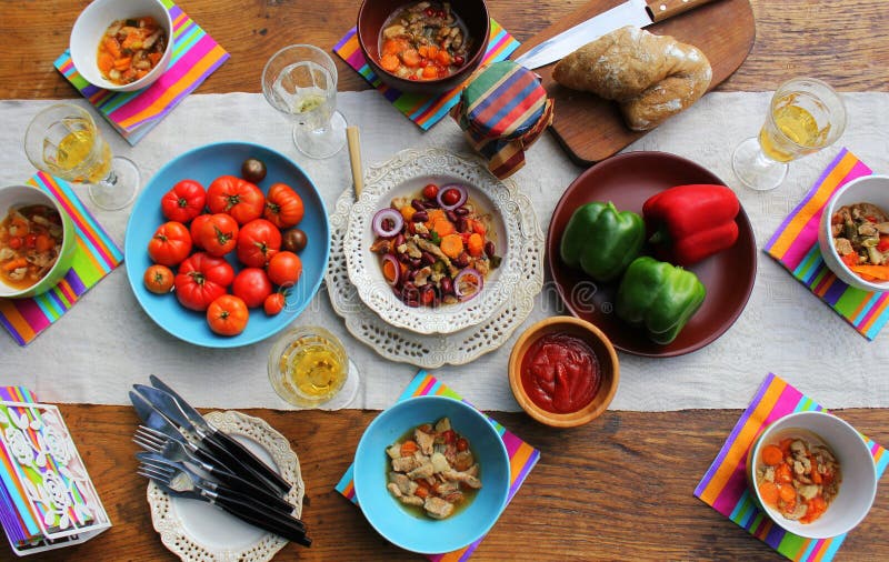 Family dinner variety of meals dishes with glass of wine on wooden table. Dinner table. a variety of snacks, festive