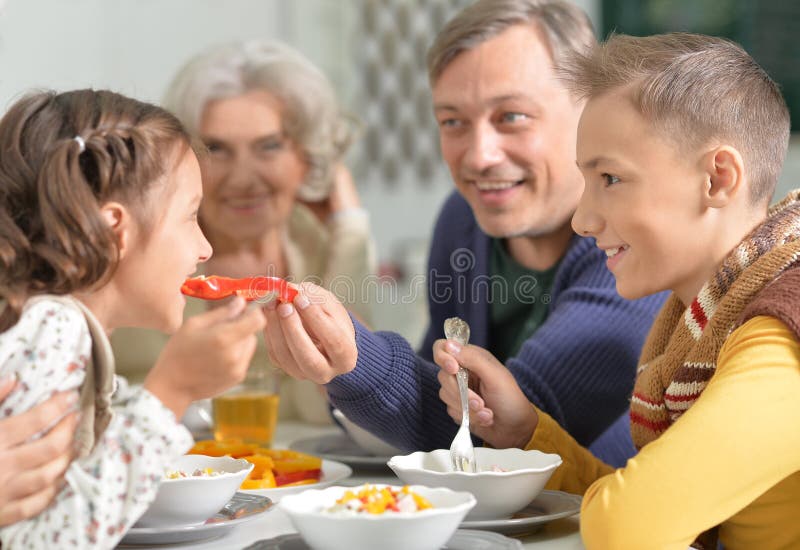 Family eating dinner stock photo. Image of grandmother - 86314472
