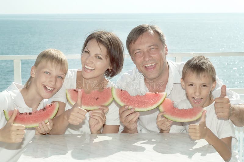Family eating watermelon