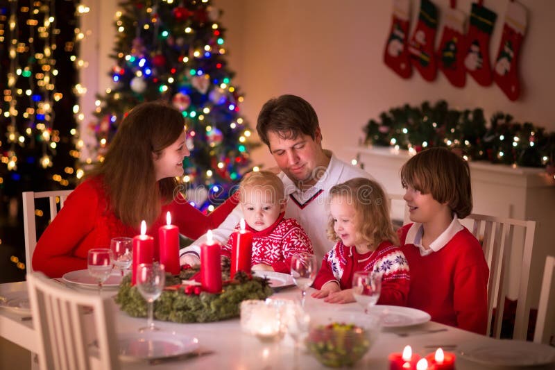 Family enjoying Christmas dinner at home