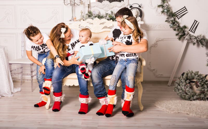 Family exchanging gifts in Christmas royalty free stock photos Family exchanging gifts in Christmas royalty free stock photos