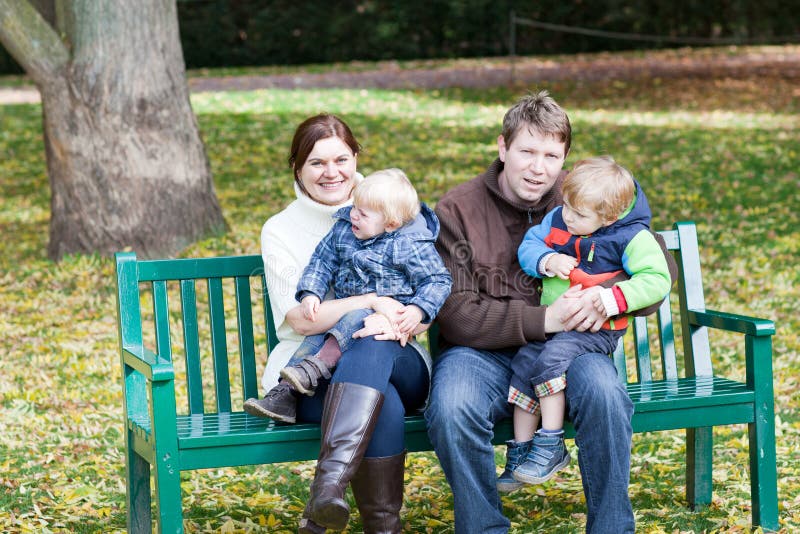 Family of four at beautiful autumn day