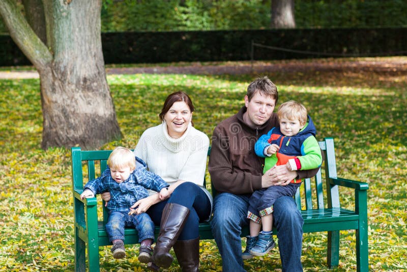 Family of four at beautiful autumn day