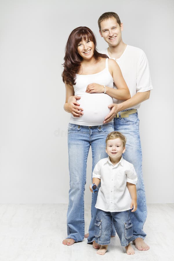 Family Full Length Portrait, Happy Pregnant Mother Father Child royalty free stock photo Family Full Length Portrait, Happy Pregnant Mother Father Child royalty free stock photo