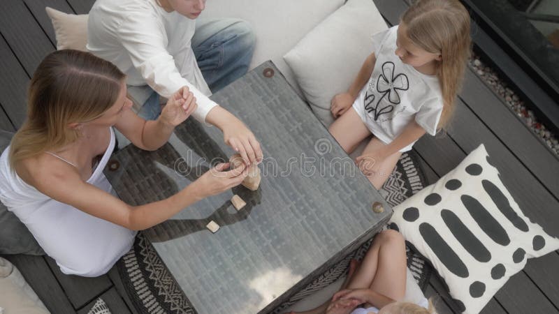 Family Gameplay : Top View of Mother&Daughs Building Wooden Block Tower stock footage