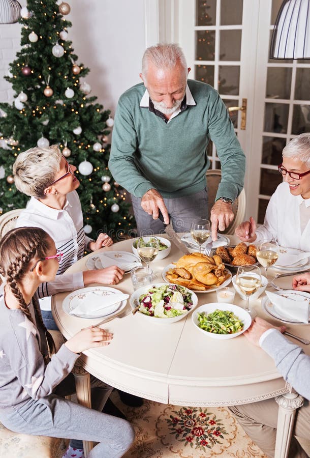 Family gathered over Christmas holidays, celebrating, having lunch royalty free stock photo Family gathered over Christmas holidays, celebrating, having lunch royalty free stock photo