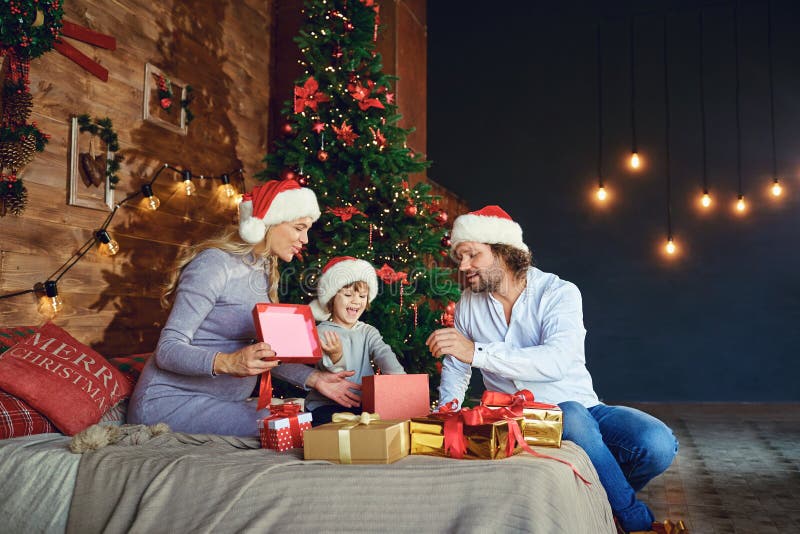 Family Giving Gifts To the House in Christmas Stock Photo - Image of ...
