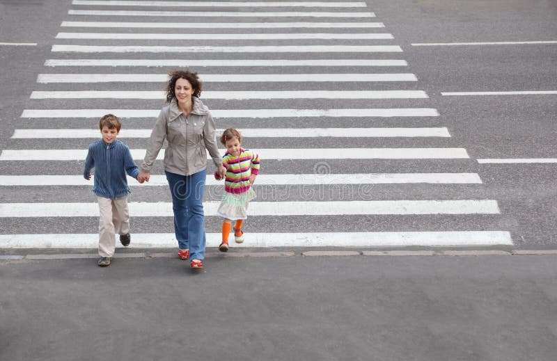 Family is going to cross road