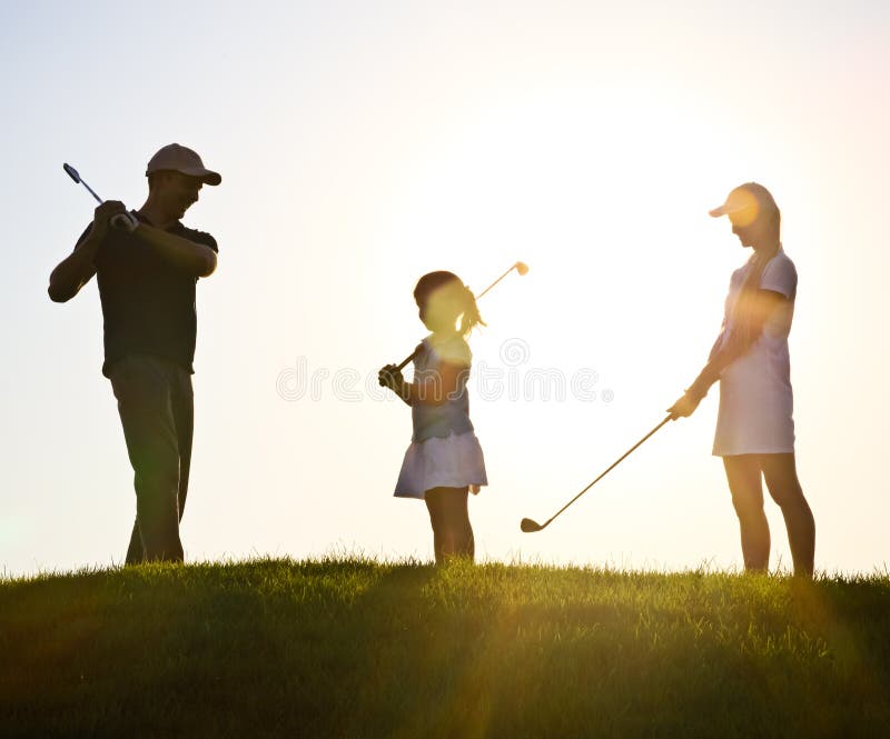 Family of a golfers at sunset