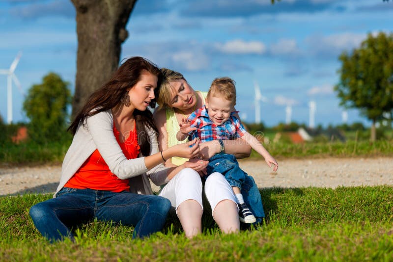 Family - Grandmother, mother and child in garden royalty free stock photography Family - Grandmother, mother and child in garden royalty free stock photography