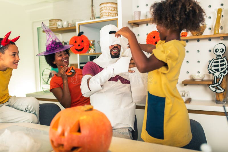 Family has fun in Halloween time stock photo