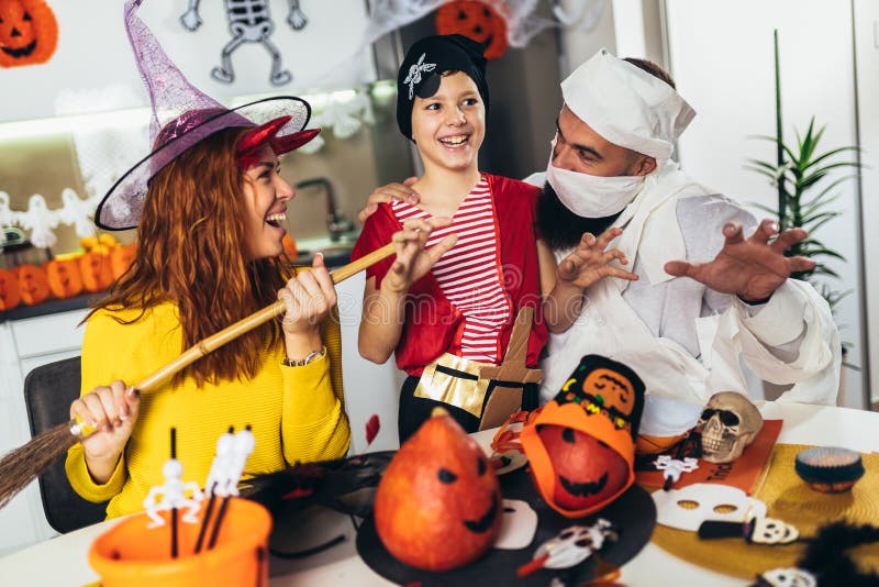 Family has fun in Halloween time at home royalty free stock images