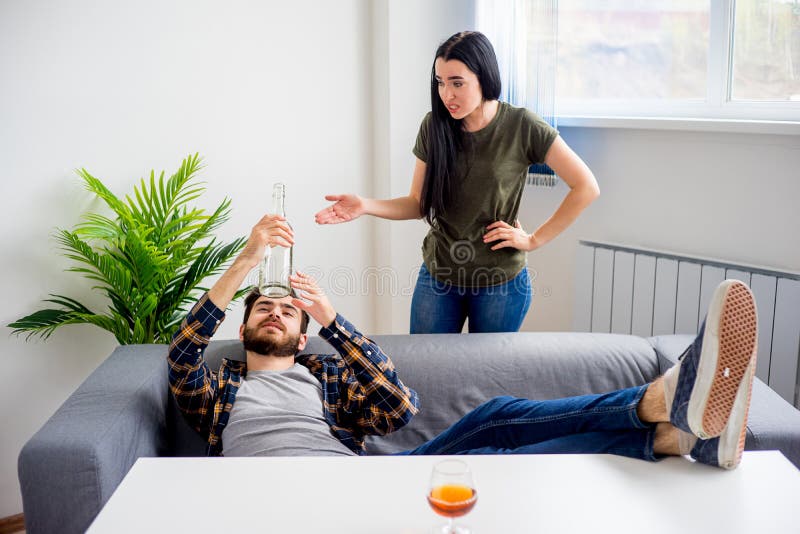 Alcohol addicted husband stock image. Image of alcoholism 100043041