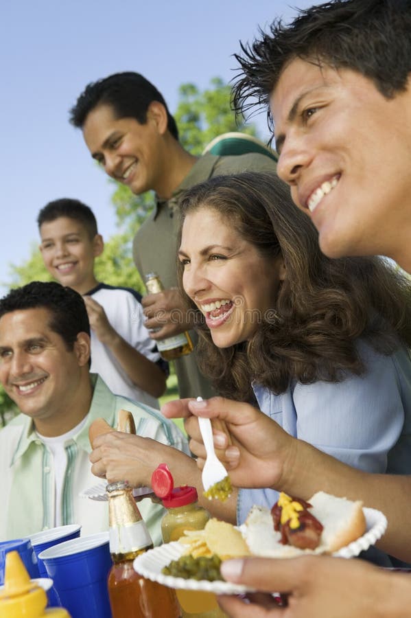 Family Having Food On A Picnic stock photos Family Having Food On A Picnic stock photos