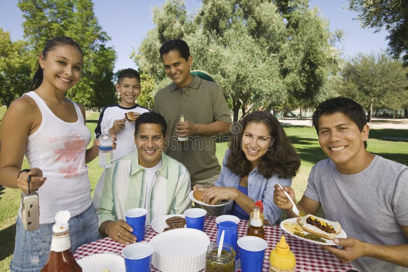 Family Having Food On A Picnic