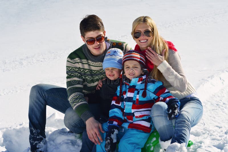 Winter season. Happy family having fun on fresh snow on vacation. Winter season. Happy family having fun on fresh snow on vacation.