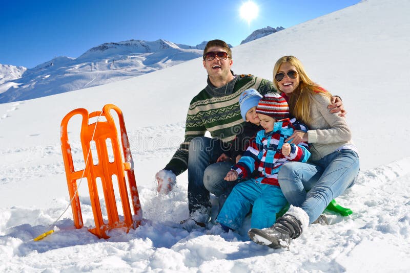 Winter season. Happy family having fun on fresh snow on vacation. Winter season. Happy family having fun on fresh snow on vacation.