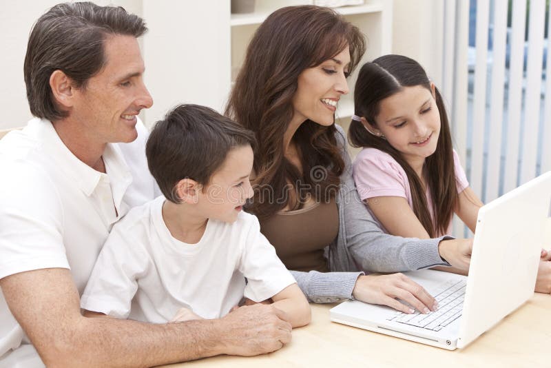Family Having Fun Using Laptop Computer At Home stock photos Family Having Fun Using Laptop Computer At Home stock photos