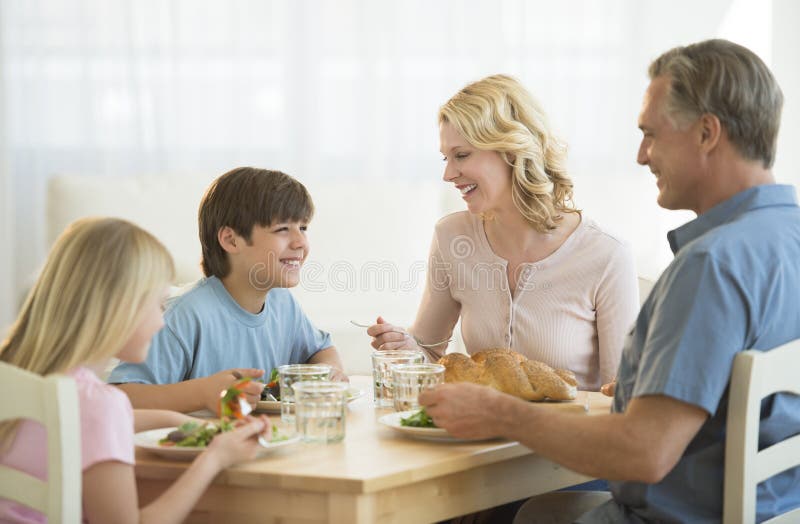 Family Having Meal At Dining Table royalty free stock images Family Having Meal At Dining Table royalty free stock images
