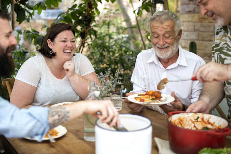 Family Having a Pasta Dinner Stock Photo - Image of senior, meal: 127871992