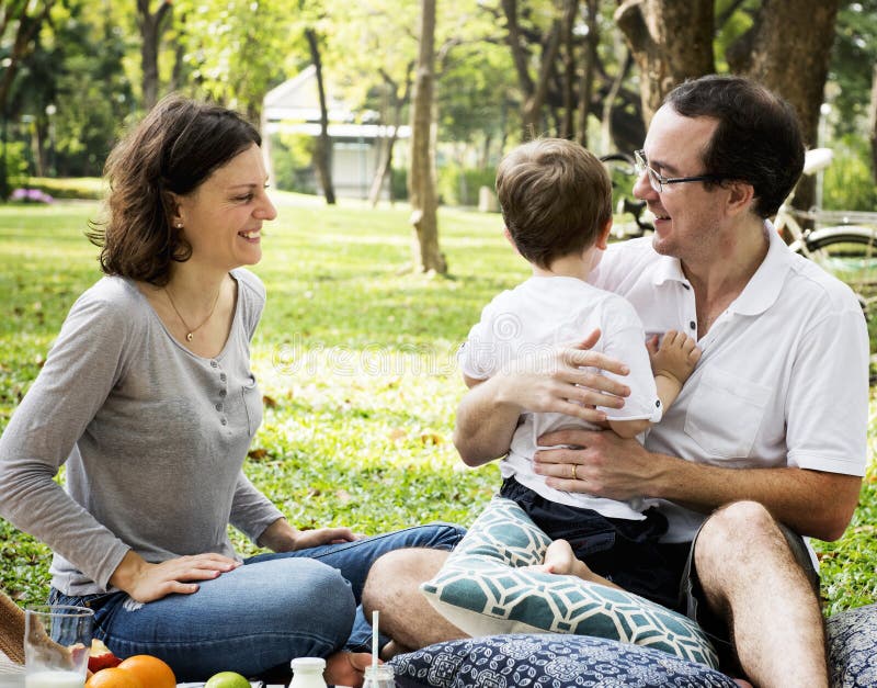 Family having a picnic in the park royalty free stock photo Family having a picnic in the park royalty free stock photo