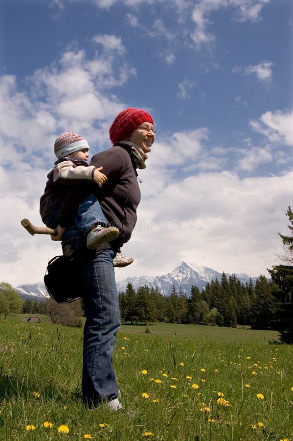 Mom and 3 years old son on hike under Krivan - (peak, symbol of Slovakia). Mom and 3 years old son on hike under Krivan - (peak, symbol of Slovakia)