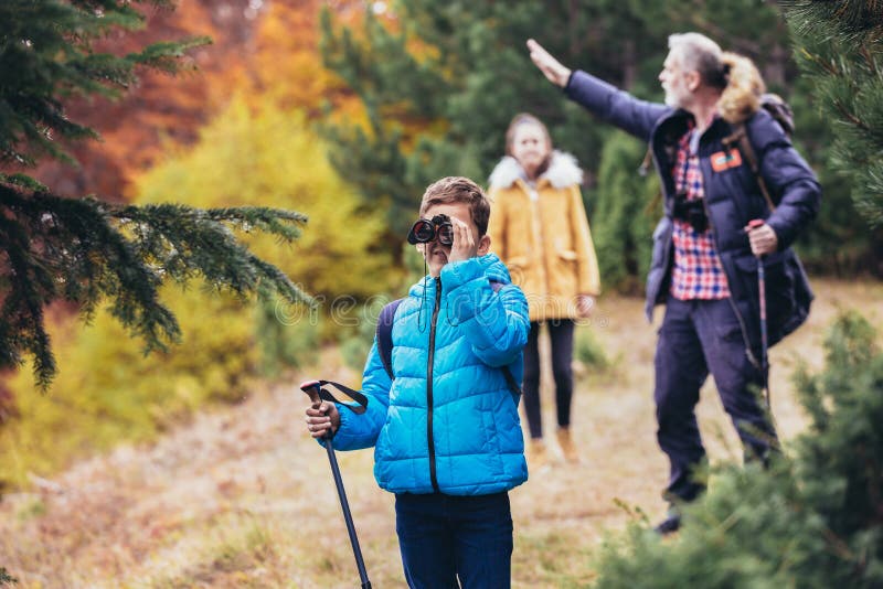 Family On Hiking Adventure Through Forest stock image