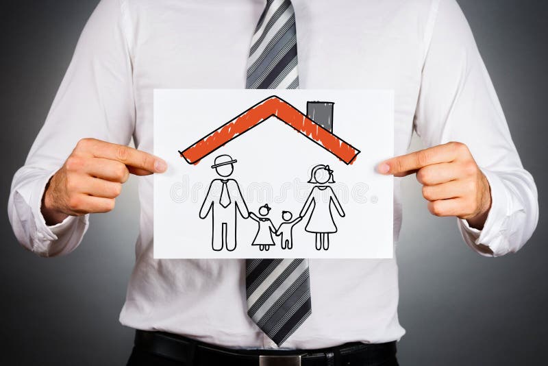 Businessman holding white paper with drawing of a family, under the home roof. Businessman holding white paper with drawing of a family, under the home roof.