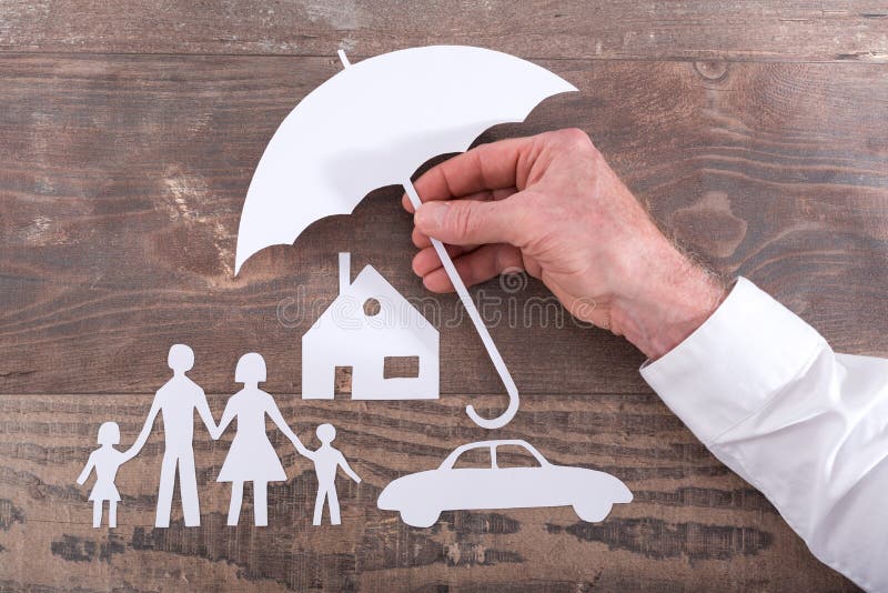 House, car and family protected with an umbrella - insurance concept. House, car and family protected with an umbrella - insurance concept