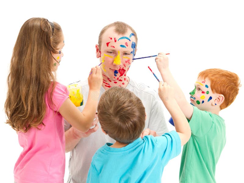 Family with kids painting with brushes on dad stock photos Family with kids painting with brushes on dad stock photos