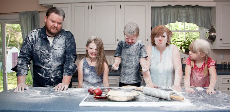 Family in kitchen after food fight