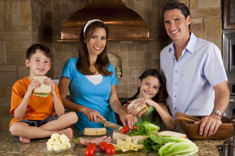 Family In Kitchen Making Healthy Sandwiches stock photography Family In Kitchen Making Healthy Sandwiches stock photography