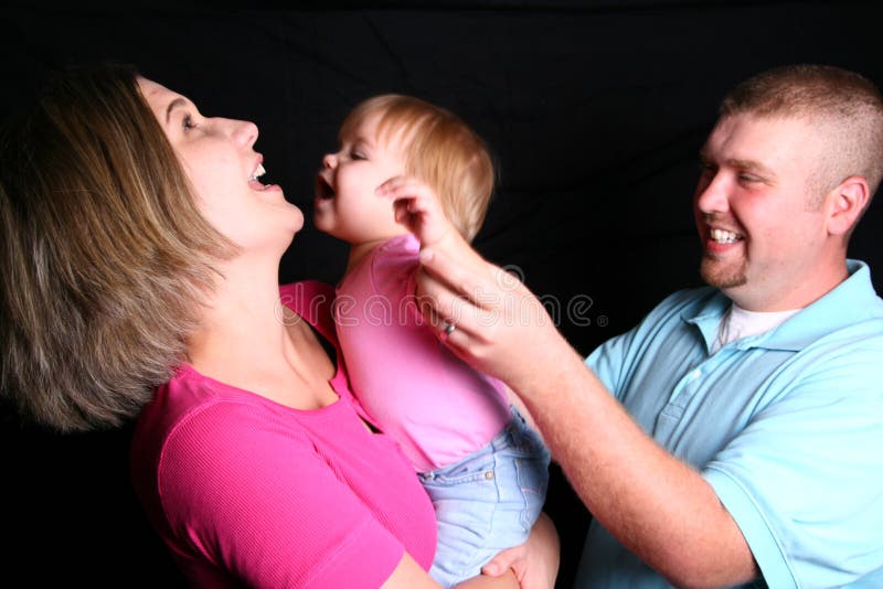 A Family Laughing and Playing