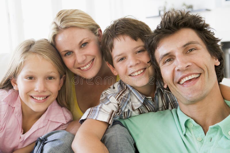 Family in living room smiling