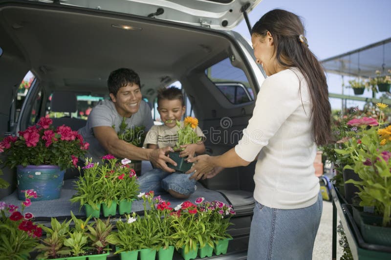 Family Loading Flowers into van