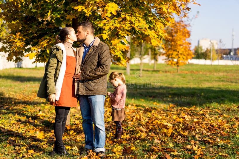 Family in love walks in autumn park stock photography Family in love walks in autumn park stock photography