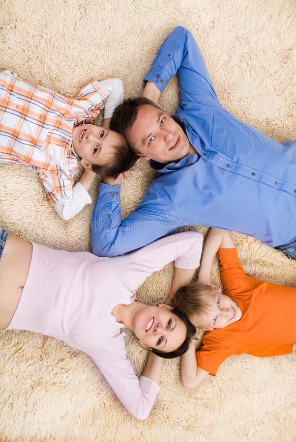 Family lying on the carpet