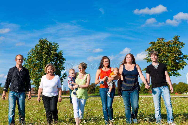Family and multi-generation - fun on meadow in summer royalty free stock images Family and multi-generation - fun on meadow in summer royalty free stock images