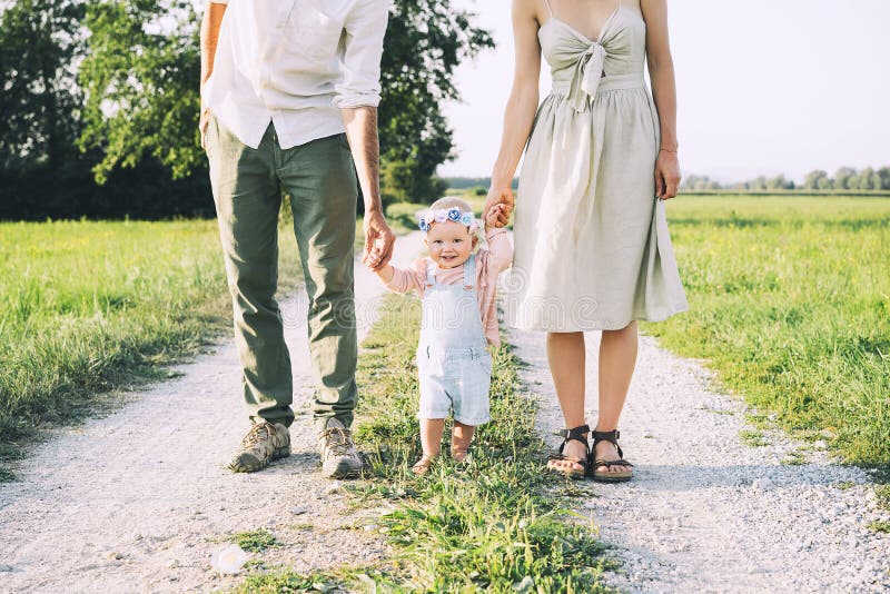 Family on nature. Mother and father with baby outdoors stock photography Family on nature. Mother and father with baby outdoors stock photography