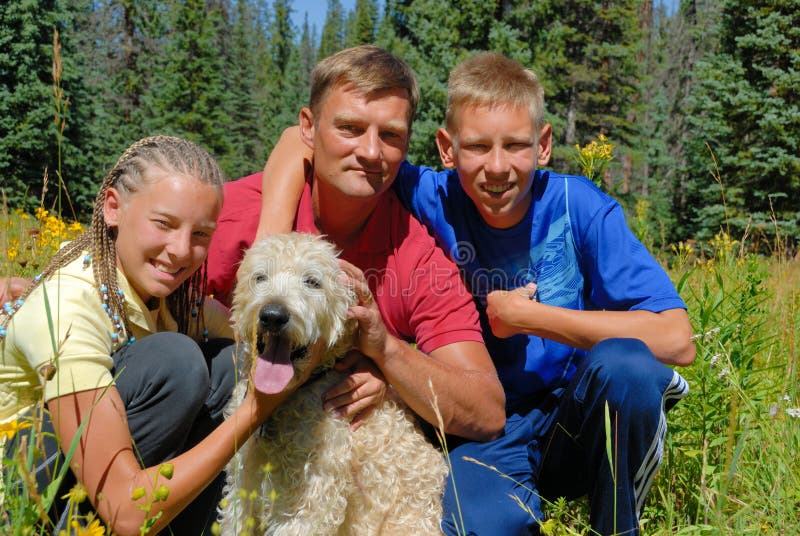 Family outdoor with dog stock image. Image of happiness 3540375