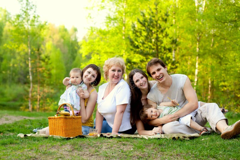 Happy family having picnic in the nature. Happy family having picnic in the nature