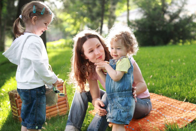 Happy family on picnic in summer park