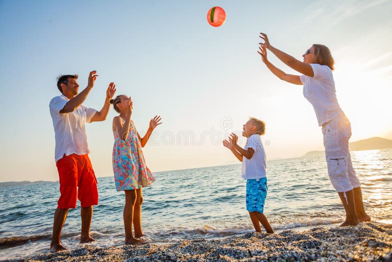 Young Male And Female In Swimwear Playing With A Beach Ball Stock Photo - Image Of -8723