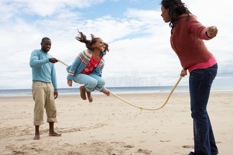 Family playing on beach stock image Family playing on beach stock image