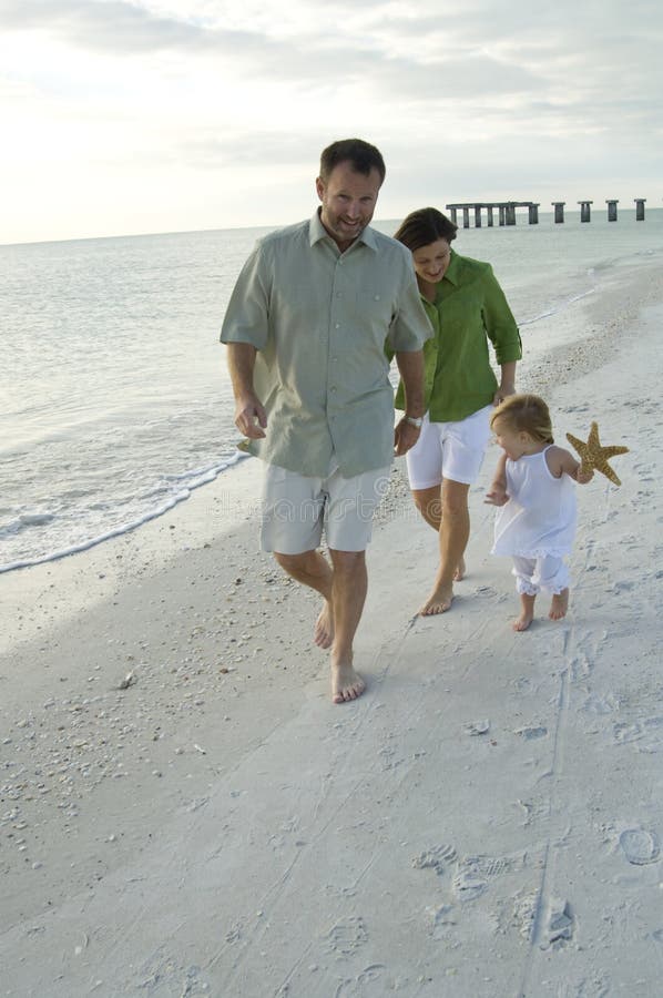 Family playing on beach royalty free stock photography Family playing on beach royalty free stock photography