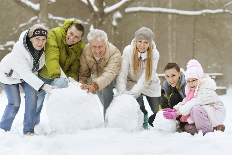 Family playing in fresh snow