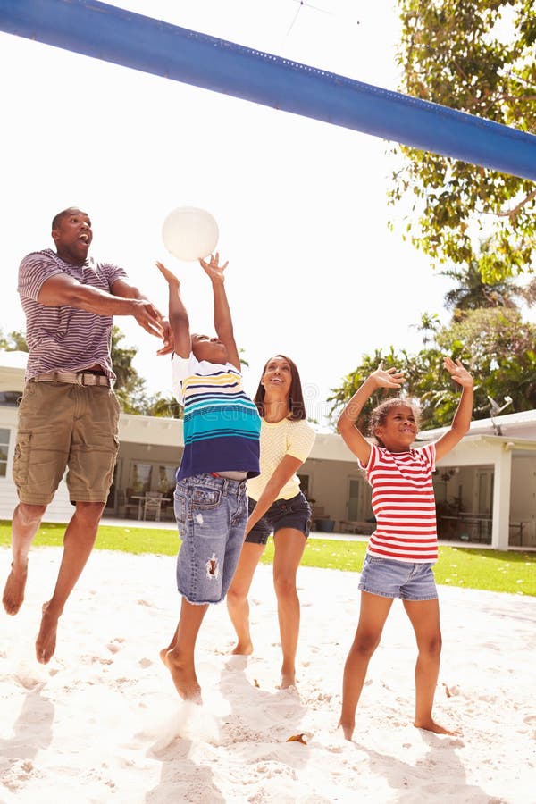 Family Playing Game of Volleyball in Garden Stock Photo Image of