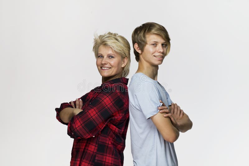 Happy and smiling mother and son. Loving family portrait against white background