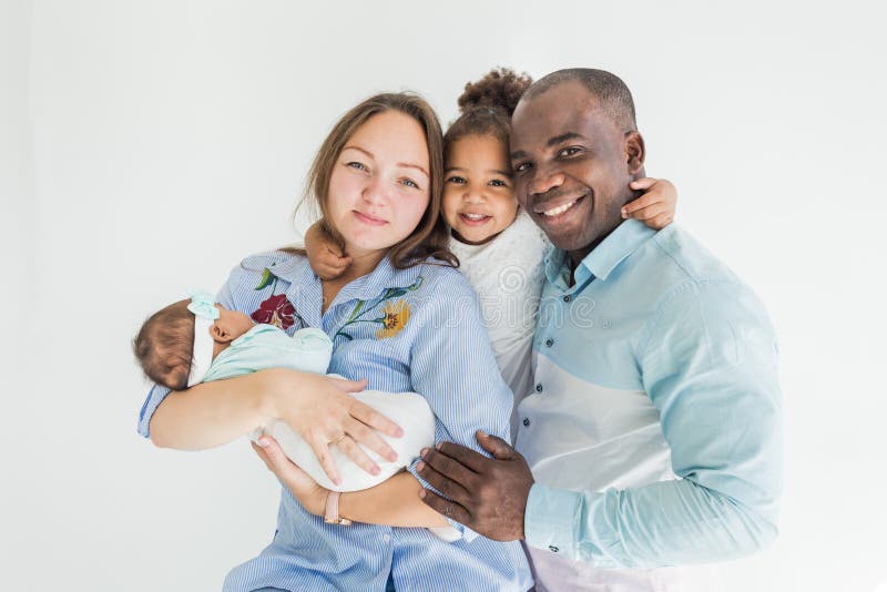 Family portrait on a white background. Happy multiethnic family. Family values